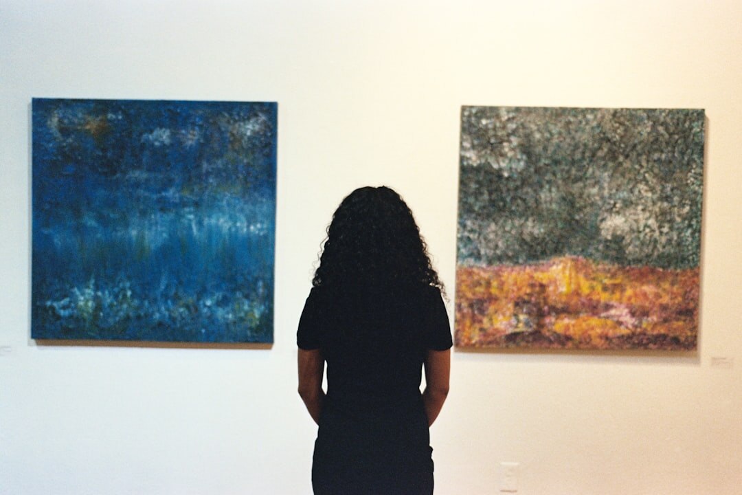 person viewing abstract painting