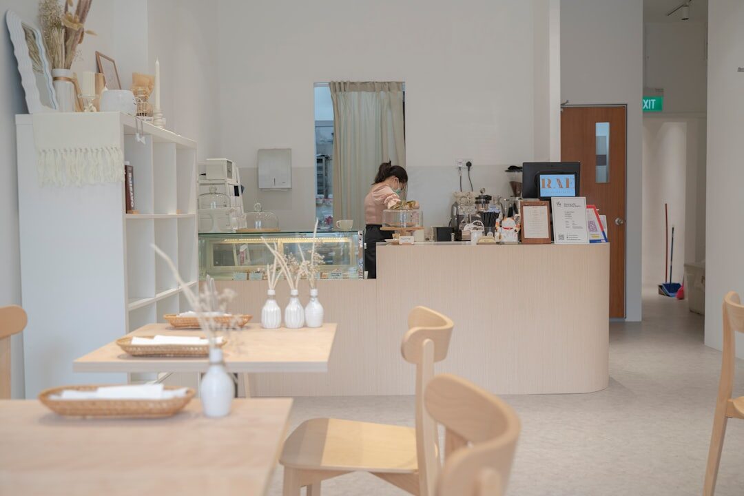 Bright coastal boutique interior with large windows and display counters